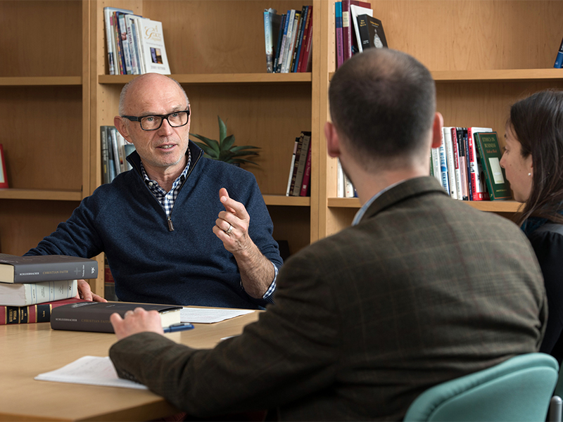 Miroslav Volf, left, speaks with post-graduate students at the Yale Divinity School on Jan. 4, 2017, in New Haven, CT. Photo by Mara Lavitt