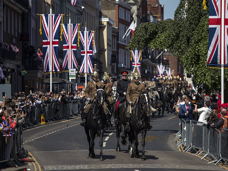 Members of the armed forces ride horses during a parade rehearsal ahead of Prince Harry and Meghan Markle's wedding in Windsor, England, on May 17, 2018. Preparations continue in Windsor ahead of the May 19 royal wedding of Britain's Prince Harry and Meghan Markle. (AP Photo/Emilio Morenatti)