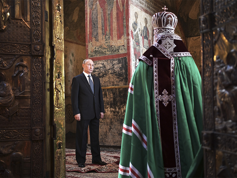 Russian President Vladimir Putin, left, attends a service held by Russian Orthodox Patriarch Krill, right, in the Annunciation Cathedral after the inauguration ceremony in the Kremlin in Moscow, Russia, on May 7, 2018. Putin took the oath of office for his fourth term as Russian president on Monday and promised to pursue an economic agenda that would boost living standards across the country. (Alexei Nikolsky, Sputnik, Kremlin Pool Photo via AP)