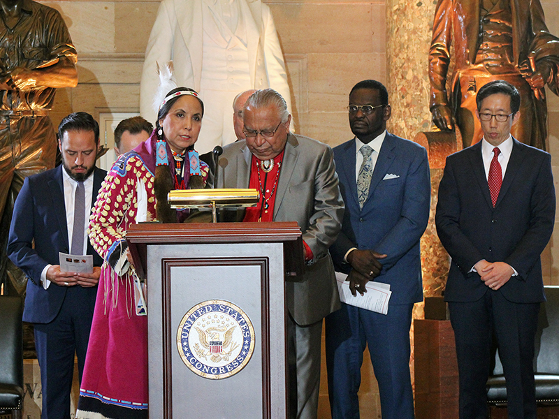 Verly Fairbanks, left at podium, and Negiel Bigpond offer prayers for “unity among all ethnicities” at a National Day of Prayer event in the Capitol’s Statuary Hall on May 3, 2018, in Washington. RNS photo by Adelle M. Banks