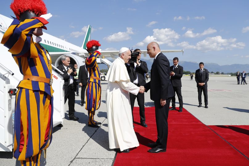 Pope Francis is welcomed by Swiss president Alain Berset, after his arrival in Geneva, Switzerland, Thursday, June 21, 2018. Pope Francis Francis arrived for a one-day visit to promote his view that Christians, whatever their theological differences, can join forces to work for peace and justice in the world.  (Peter Klaunzer/pool photo via AP)