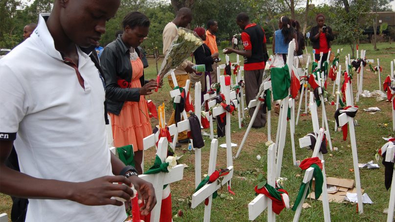 Youth light candles at Freedoms Corner to remember students killed by Al-Shabaab at Garissa University College in April 2015 in Garissa, Kenya. RNS photo by Fredrick Nzwili