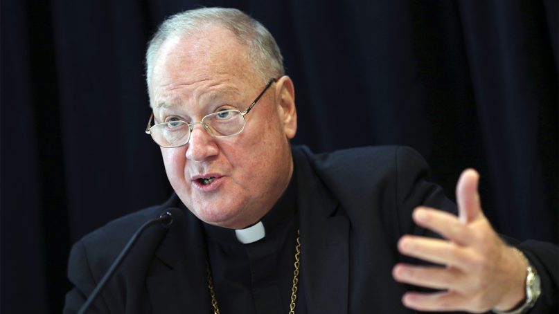 Cardinal Timothy Dolan, Archbishop of New York, speaks to reporters during a news conference in New York on Oct. 6, 2016. Dolan helped to announce a new program intended to provide reconciliation and compensation for victims of sexual abuse by clergy. (AP Photo/Seth Wenig)