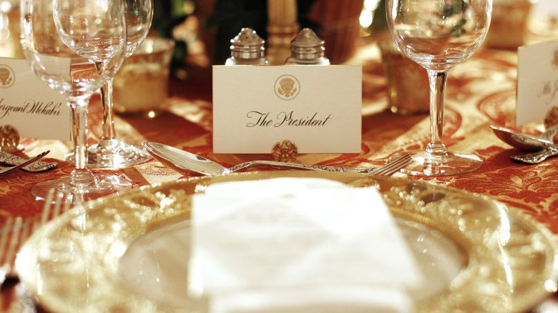 The presidential place setting prior to an iftar dinner in the State Dining Room of the White House in Washington, on Aug. 10, 2011. (AP Photo/Pablo Martinez Monsivais)