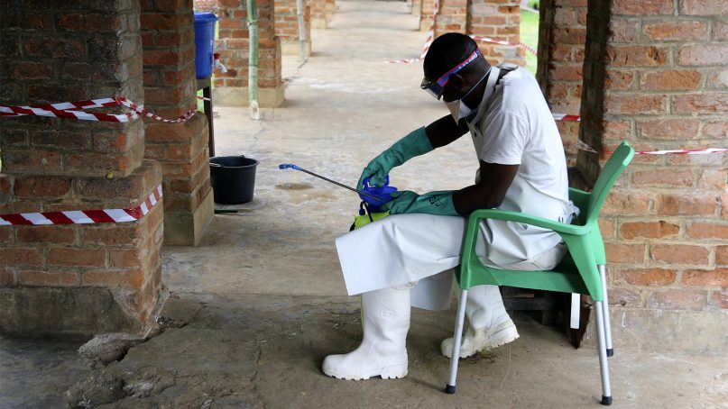 A health care worker wears virus protective gear at a treatment center in Bikoro,  Democratic Republic of Congo, on May 13, 2018. (AP Photo/John Bompengo)