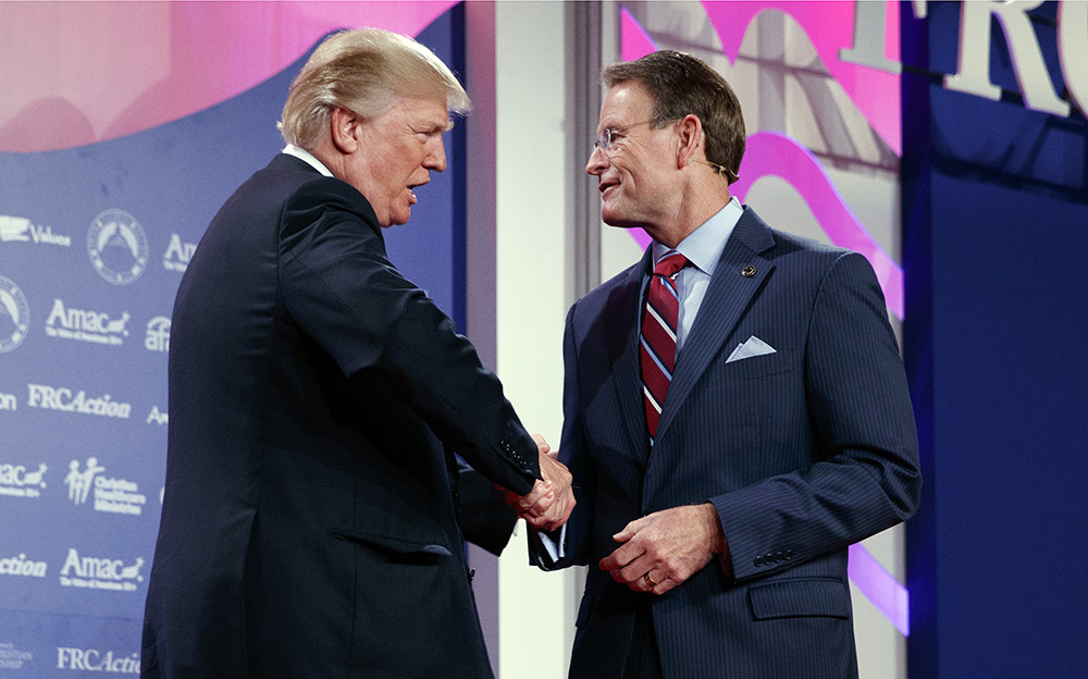 President Trump shakes hands with Family Research Council president Tony Perkins at the 2017 Values Voter Summit, on Oct. 13, 2017, in Washington. (AP Photo/Evan Vucci)