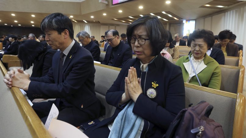 People pray during a special service to wish for a successful inter-Korean summit and peace on the Korean peninsula at a church in Seoul, South Korea, on April 19, 2018. (AP Photo/Ahn Young-joon)
