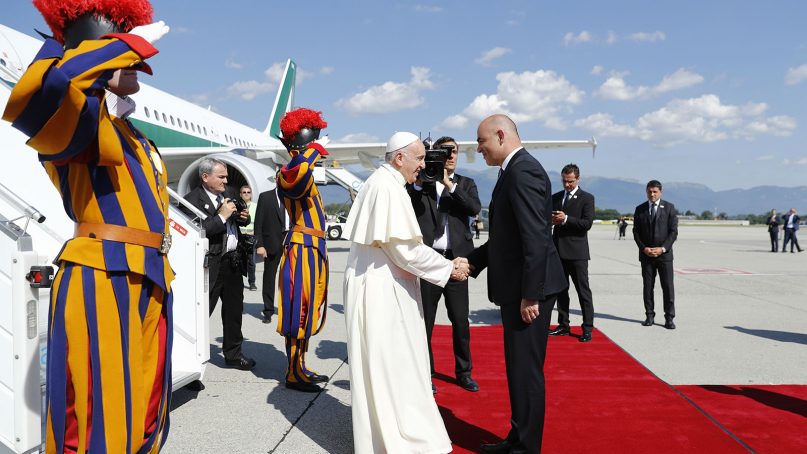 Pope Francis is welcomed by Swiss president Alain Berset, after his arrival in Geneva, Switzerland, on June 21, 2018. Pope Francis Francis arrived for a one-day visit to promote his view that Christians, whatever their theological differences, can join forces to work for peace and justice in the world.  (Peter Klaunzer/pool photo via AP)
