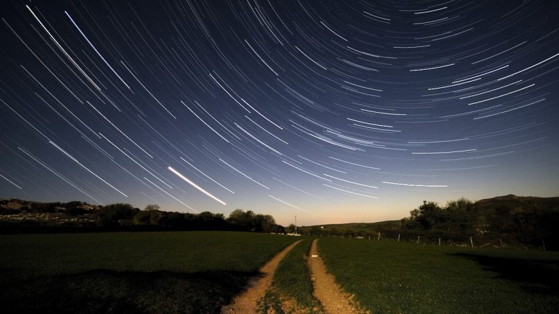 Stars drift by in a long exposure as night passes. Photo by Carl Jones/Creative Commons