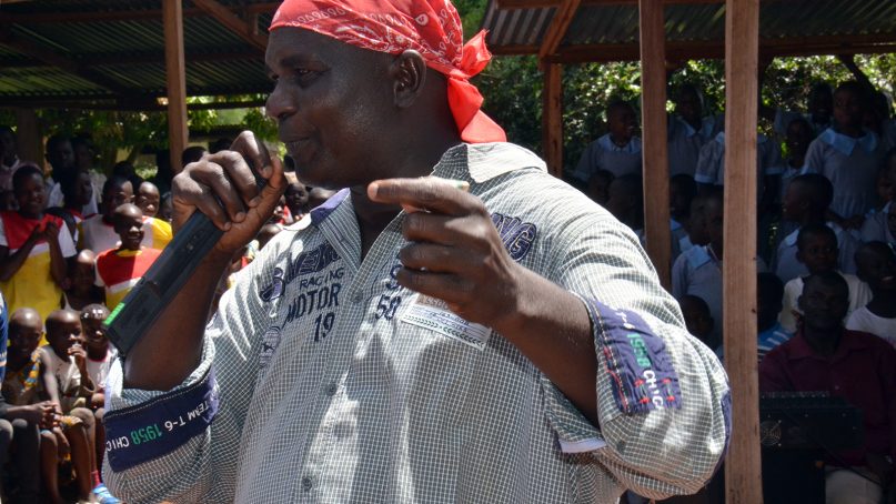 The Rev. Paul Ogalo raps at St. Monica Catholic Church in western Kenya on May 6, 2018. His style of preaching, using secular music, drama and dance, is popular with youth. Ogalo raps about how youth can fight social vices such as drug abuse, crime and HIV/AIDS. RNS photo by Tonny Onyulo