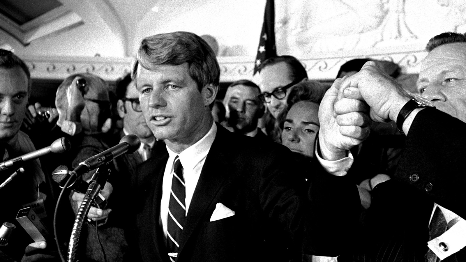 Sen. Robert F. Kennedy addresses a throng of supporters in the Ambassador Hotel in Los Angeles early in the morning of June 5, 1968, following his victory in the previous day's California primary election. A moment later he turned into a hotel kitchen corridor and was critically wounded. His wife, Ethel, is just behind him. (AP Photo/Dick Strobel)
