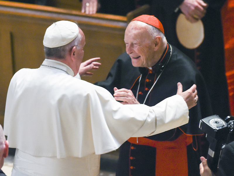 FILE - In this Sept. 23, 2015 file photo, Pope Francis reaches out to hug Cardinal Archbishop emeritus Theodore McCarrick after the Midday Prayer of the Divine with more than 300 U.S. Bishops at the Cathedral of St. Matthew the Apostle in Washington. The retired archbishop of Washington, D.C. has been removed from public ministry over allegations he sexually abused a teenager while a priest in New York more than 40 years ago. (Jonathan Newton / The Washington Post via AP, File)