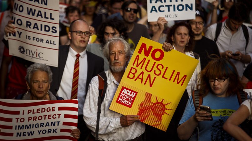 People protest during a rally about the U.S. Supreme Court's decision to uphold President Trump's ban on travel from several mostly Muslim countries on June 26, 2018, in New York. (AP Photo/Andres Kudacki)