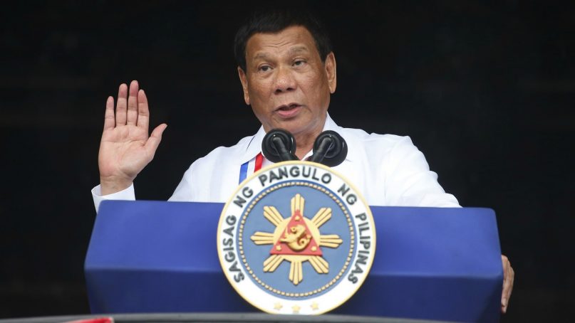 Philippine President Rodrigo Duterte gestures while addressing the crowd after leading the flag-raising rites June 12, 2018, at the 120th Philippine Independence Day celebration at the Emilio Aguinaldo Shrine at Kawit, Cavite province, south of Manila, Philippines. Duterte's speech was marred by protesters who heckled him with shouts of 
