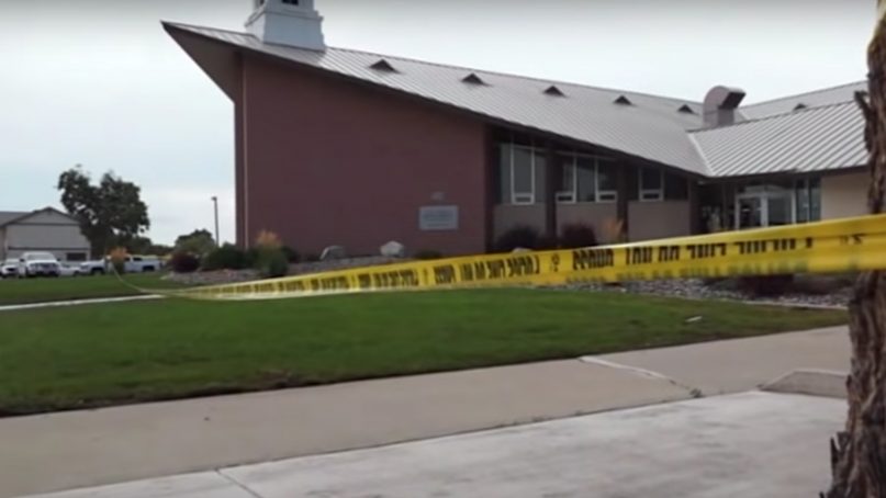 Crime scene tape surrounds a Mormon church in Fallon, Nev., after a fatal shooting on July 22, 2018. Screenshot via AP video