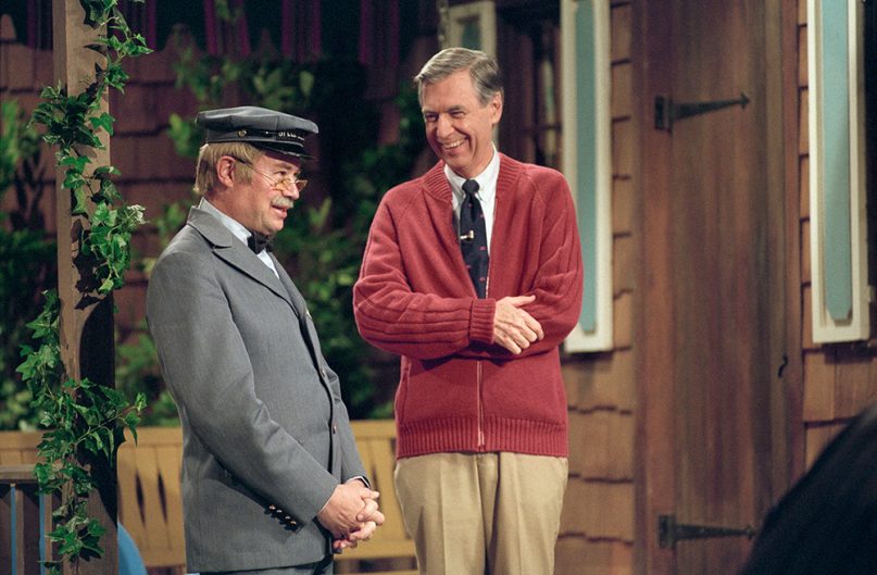 Fred Rogers, right, and David Newell, as Speedy Delivery's Mr. McFeely, stand on the front porch set while filming an episode of 