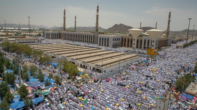 Muslim pilgrims attend noon prayers outside the Namirah mosque on Arafat Mountain during the hajj, outside the holy city of Mecca, Saudi Arabia, on Aug. 20, 2018. More than 2 million Muslims have begun the annual hajj pilgrimage. The five-day pilgrimage represents one of the five pillars of Islam and is required of all able-bodied Muslims once in their life. (AP Photo/Dar Yasin)