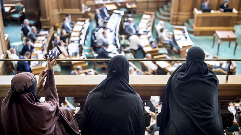 Women wearing the Islamic veil niqab sit in the audience seats of the Danish Parliament, at Christiansborg Castle, in Copenhagen, Denmark, on May 31, 2018. Denmark joined some other European countries in deciding to ban garments that cover the face, including Islamic veils such as the niqab or burqa. (Mads Claus Rasmussen/Ritzau Scanpix via AP)