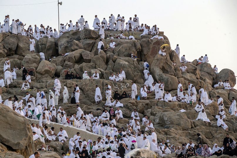 Muslim pilgrims gather at the Jabal al-Rahma holy mountain, or the mountain of forgiveness, at Arafat for the annual hajj pilgrimage outside the holy city of Mecca, Saudi Arabia, on Aug. 20, 2018. The five-day pilgrimage represents one of the five pillars of Islam and is required of all able-bodied Muslims once in their life. (AP Photo/Dar Yasin)