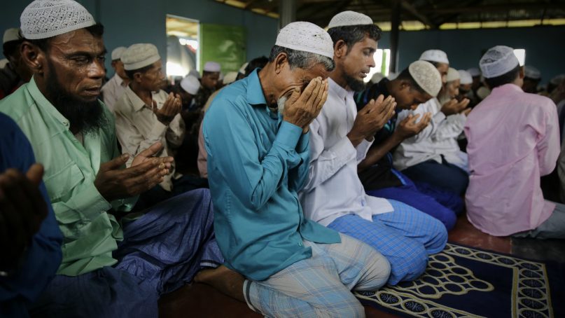 Rohingya refugees cry as they pray inside a mosque on Eid al Adha at Kutupalong refugee camp, Bangladesh, Wednesday, Aug. 22, 2018. Hundreds of thousands of Rohingya refugees are celebrating Eid al-Adha in sprawling Bangladeshi camps where they have been living amid uncertainty over their future after they fled Myanmar to escape violence and a massive crackdown. (AP Photo/Altaf Qadri)