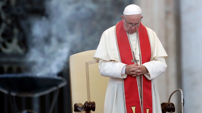 Pope Francis prays during an audience in St. Peter's Square at the Vatican on July 31, 2018.  (AP Photo/Alessandra Tarantino)