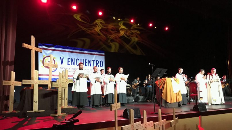 Crosses can be seen on stage at the Gaylord Texan Resort and Convention Center in Grapevine, Texas, on Sept. 20, 2018. San Antonio Archbishop Gustavo García-Siller, far right, led an opening prayer at the V Encuentro meeting. RNS photo by Bobby Ross Jr.