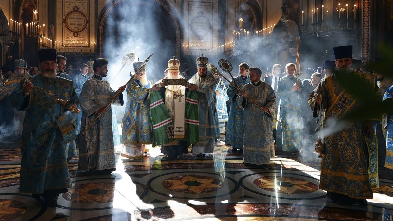 Russian Orthodox Church Patriarch Kirill, center, welcomes relics of St. Spyridon, bishop of Trimythous, from Corfu, Greece, during a service at the Christ the Saviour Cathedral in Moscow on Sept. 21, 2018. (Igor Palkin, Russian Orthodox Church Press Service via AP)