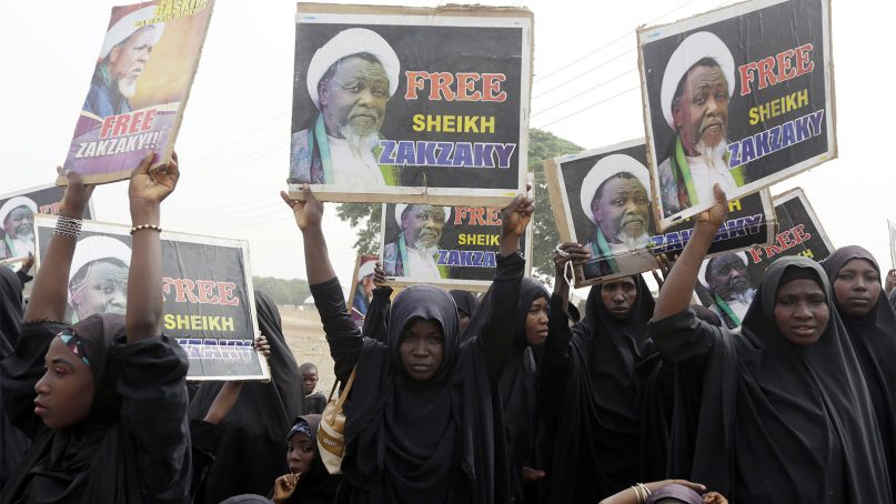 In this April 1, 2016, file photo, Nigerian Shiite Muslims take to the streets to protest and demand the release of Shiite leader Ibrahim Zakzaky in Cikatsere, Nigeria. (AP Photo/Sunday Alamba)