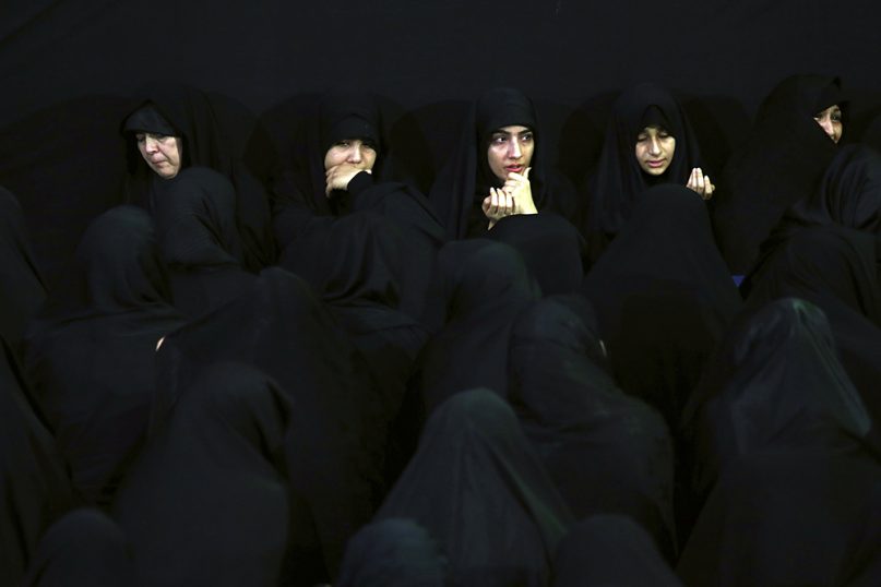 Muslim Shiite women mourn during the holy day of Ashura at the Sadat Akhavi Mosque in Tehran, Iran, on Sept. 20, 2018. Ashura is the annual Shiite commemoration of the death of Imam Hussein, the grandson of the Prophet Muhammad, at the Battle of Karbala in present-day Iraq in the 7th century. (AP Photo/Ebrahim Noroozi)