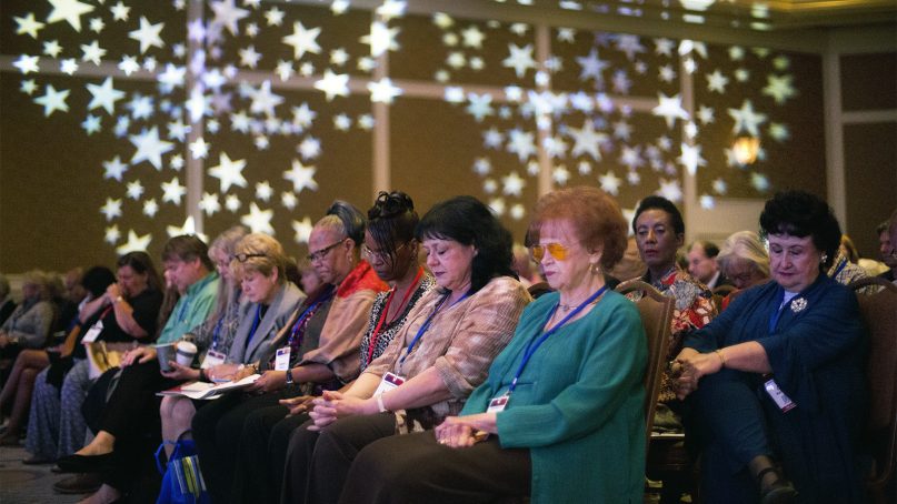 Attendees lower their heads for a prayer at the opening ceremonies of the 2018 Values Voter Summit in Washington, D.C., on Sept. 21, 2018. (AP Photo/Pablo Martinez Monsivais)