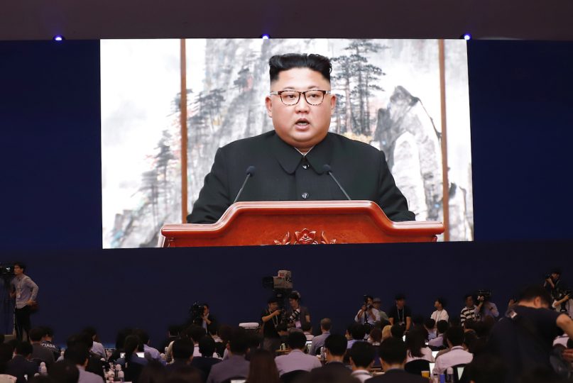 Members of the media watch a huge screen showing North Korean leader Kim Jong Un speak during a joint news conference in Pyongyang, North Korea, at a press center for the inter-Korean summit in Seoul, South Korea, on Sept. 19, 2018. (AP Photo/Lee Jin-man)
