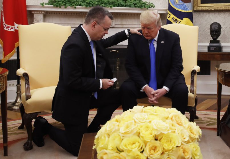 President Trump prays with American pastor Andrew Brunson in the Oval Office of the White House on Oct. 13, 2018, in Washington. Brunson returned to the U.S. around midday after he was freed Friday, from nearly two years of detention in Turkey. (AP Photo/Jacquelyn Martin)