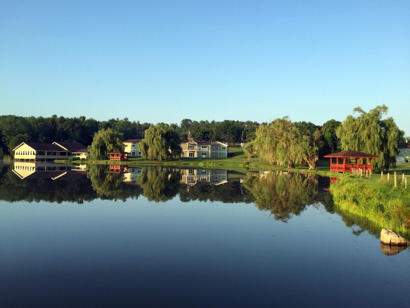 A lake reflects the URJ Kutz Camp in Warwick, NY. Photo courtesy of URJ
