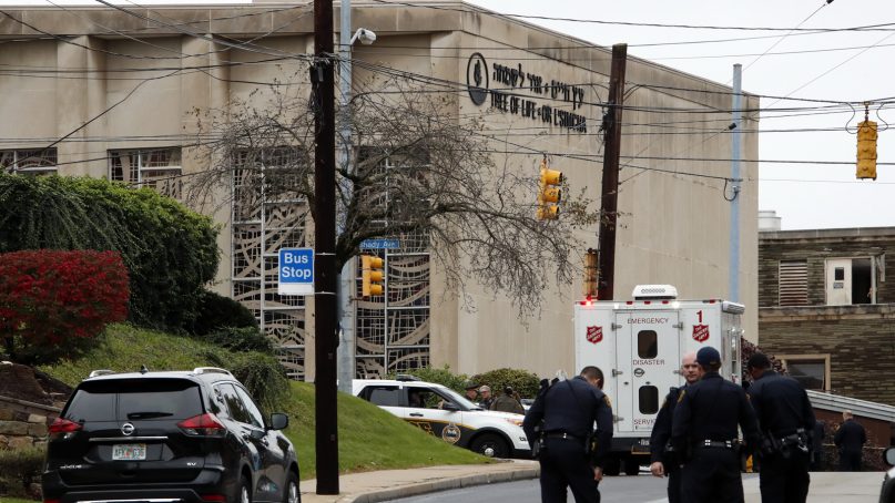 First responders stand outside the Tree of Life Synagogue in Pittsburgh, where a shooter opened fire Saturday, Oct. 27, 2018, injuring multiple people, including police officers. (AP Photo/Gene J. Puskar)