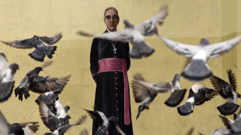 Pigeons fly in front of a mural of Archbishop Oscar Arnulfo Romero, on a wall of the Metropolitan Cathedral in San Salvador, El Salvador, on Oct. 3. 2018. Romero, who was killed in 1980 by a right wing death squad during Mass, will be canonized in Rome by Pope Francis on Sunday, Oct. 14, 2018. (AP Photo/Salvador Melendez)