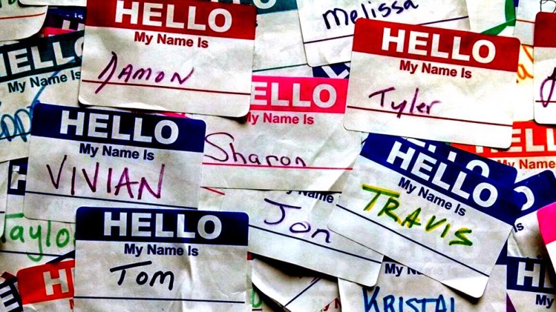 A wall of name stickers in Chicago. Photo by Travis Wise/Creative Commons