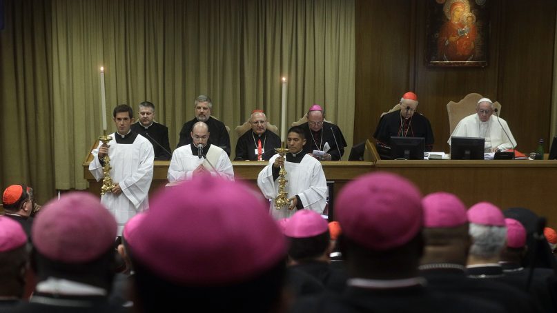 Pope Francis, top right, attends the opening of the 15th Ordinary General Assembly of the Synod of Bishops, at the Vatican, on Oct. 3, 2018. The Oct. 3-28 synod opened under a fresh cloud of scandal with new revelations about decades of sexual misconduct and cover-up in the U.S., Chile, Germany and elsewhere. That has sent confidence in Francis' leadership to all-time lows among the American faithful. (AP Photo/Gregorio Borgia)