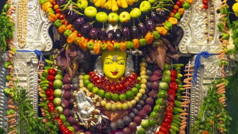 An idol of the Hindu mother goddess Devi Saraswati is wrapped in fruits and vegetables at Sri Siva Vishnu Temple in Maryland. Photo courtesy of Ashwani Ramamurty