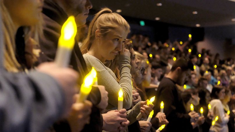 People gather to pray for the victims of a mass shooting during a candlelight vigil in Thousand Oaks, Calif., on Nov. 8, 2018. A gunman opened fire Wednesday evening inside a country music bar, killing multiple people, including a responding sheriff's sergeant. (AP Photo/Ringo H.W. Chiu)