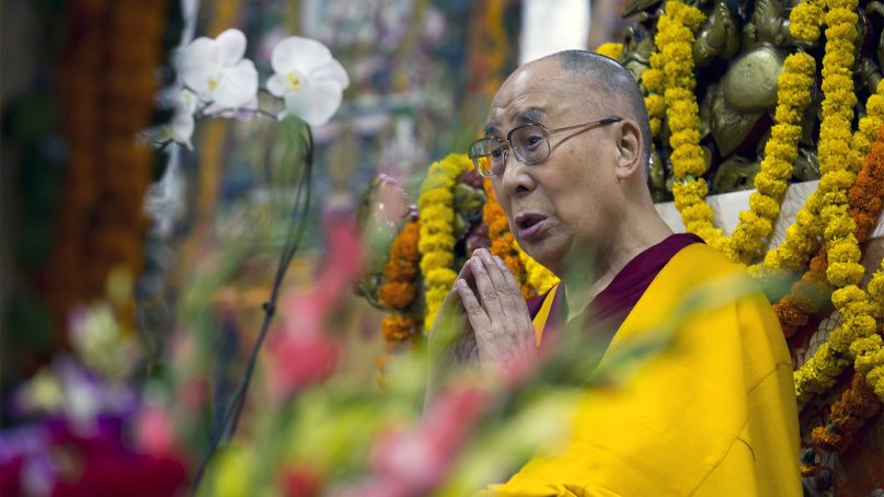 Tibetan spiritual leader the Dalai Lama leads a prayer at the Tsuglagkhang Temple in Dharamshala, India, on Sept. 3, 2018. Tibetans made ceremonial offerings and prayed for the longevity of their spiritual leader. (AP Photo/Ashwini Bhatia)