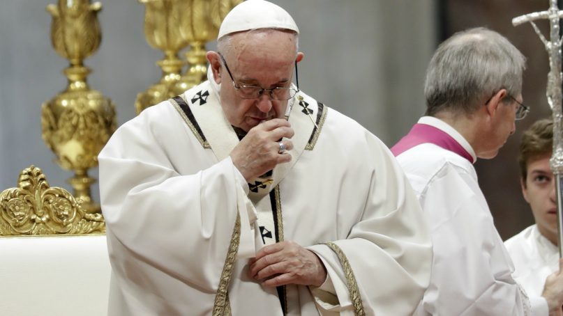 Pope Francis celebrates a Mass on Nov. 18, 2018, in St. Peter's Basilica at the Vatican. Francis offered several hundred poor people, homeless, migrants and unemployed a lunch on Sunday as he celebrates the World Day of the Poor with a concrete gesture of charity in the spirit of his namesake, St. Francis of Assisi. (AP Photo/Andrew Medichini)
