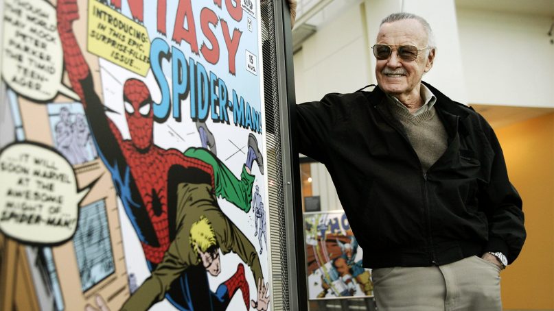 Comic book creator Stan Lee stands beside some of his drawings in the Marvel Super Heroes Science Exhibition at the California Science Center in Los Angeles on March 21, 2006. (AP Photo/Damian Dovarganes)