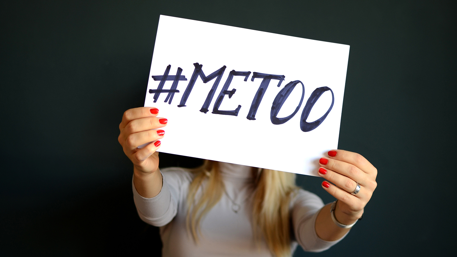 A woman holds a #MeToo sign. Photo courtesy of Creative Commons