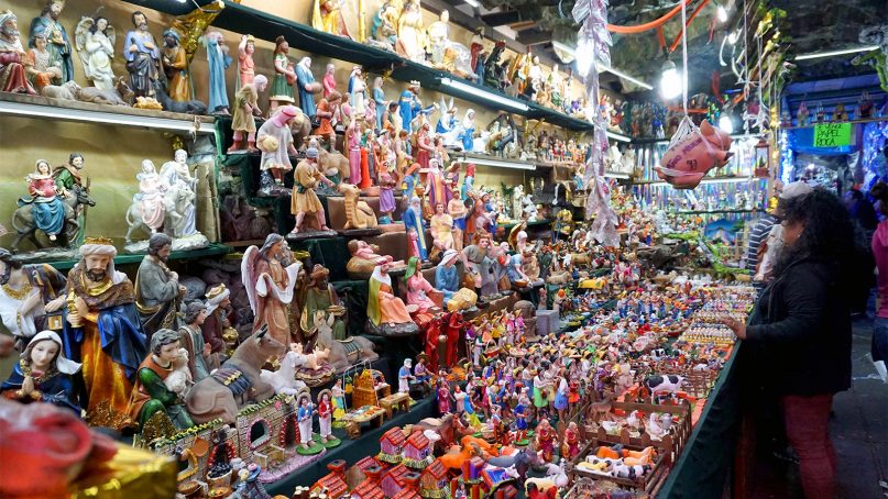 Religious items produced in Asia can be purchased in Mexico City markets at lower prices than their Mexican-made equivalents. Many merchants sell both Asian and Mexican products, which they say gives consumers the choice of either lower prices or locally made products. RNS photo by Irving Cabrera Torres