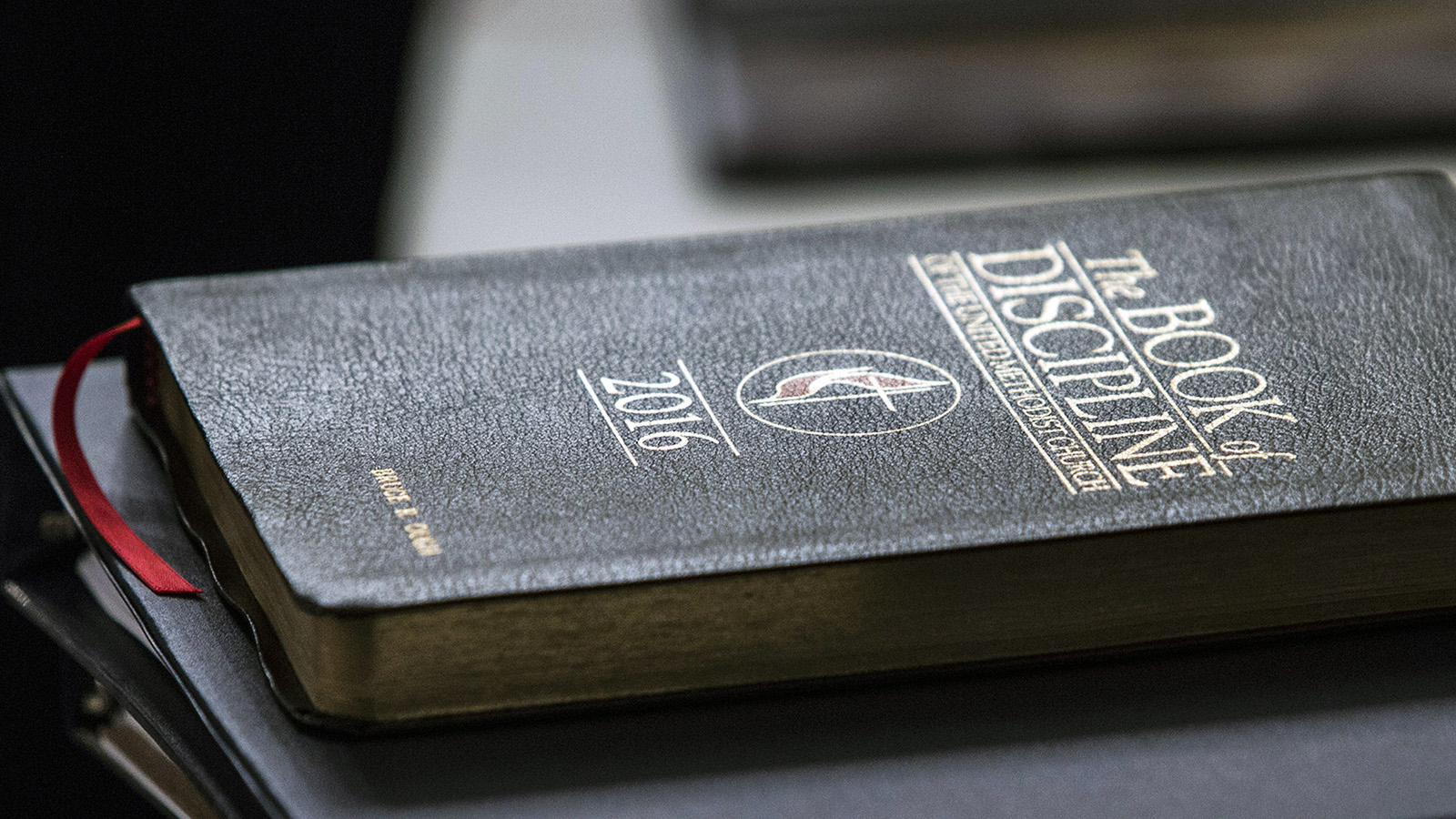 A copy of the Book of Discipline rests on a table during an oral hearing on May 22, 2018, in Evanston, Ill. The United Methodist Judicial Council, the denomination’s top court, heard arguments regarding a request from the Council of Bishops for a ruling on whether United Methodist organizations, clergy or lay members can submit petitions for the special General Conference in 2019. The hearing was part of the court’s May 22-25 special session. Photo by Kathleen Barry/UMNS