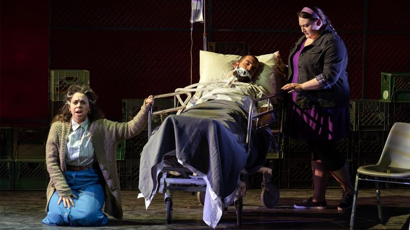 With Daddy (Timothy J. Bruno) dying, his wife Nelda (Eliza Bonet), left, and estranged daughter Kayla (Alexandria Shiner) have different feelings toward him in AOI’s “Taking Up Serpents” production by Washington National Opera at the Kennedy Center. Photo by Scott Suchman