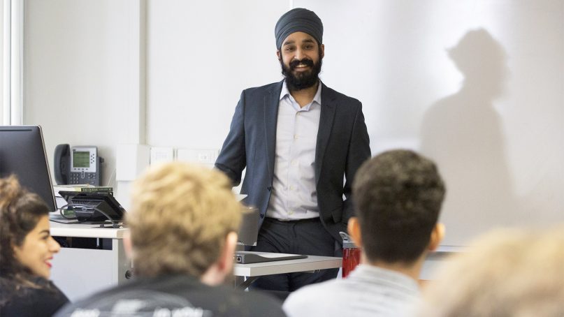 Simran Jeet Singh interacts with his students during class at Trinity University in San Antonio, Texas, on Jan. 12, 2017. Photo courtesy of San Antonio Express-News/Ray Whitehouse