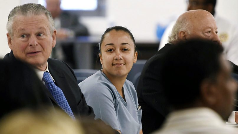 Cyntoia Brown, a woman serving a life sentence for killing a man when she was a 16-year-old prostitute, smiles at family members during her clemency hearing on May 23, 2018, at Tennessee Prison for Women in Nashville. (Lacy Atkins /The Tennessean via AP)