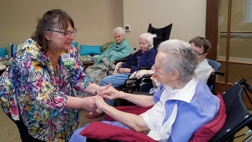 The Rev. Jamie Moyer, left, chaplain at Phoebe Richland, a skilled nursing center in Richlandtown, Pa., greets resident Shirley Derstine on Nov. 5, 2018, for a “Spirit Alive” service. RNS photo by Adelle M. Banks