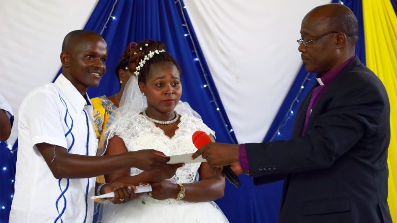 A newlywed couple poses for a photo after exchanging wedding vows on Dec. 8, 2018, in Mombasa, Kenya. RNS photo by Tonny Onyulo
